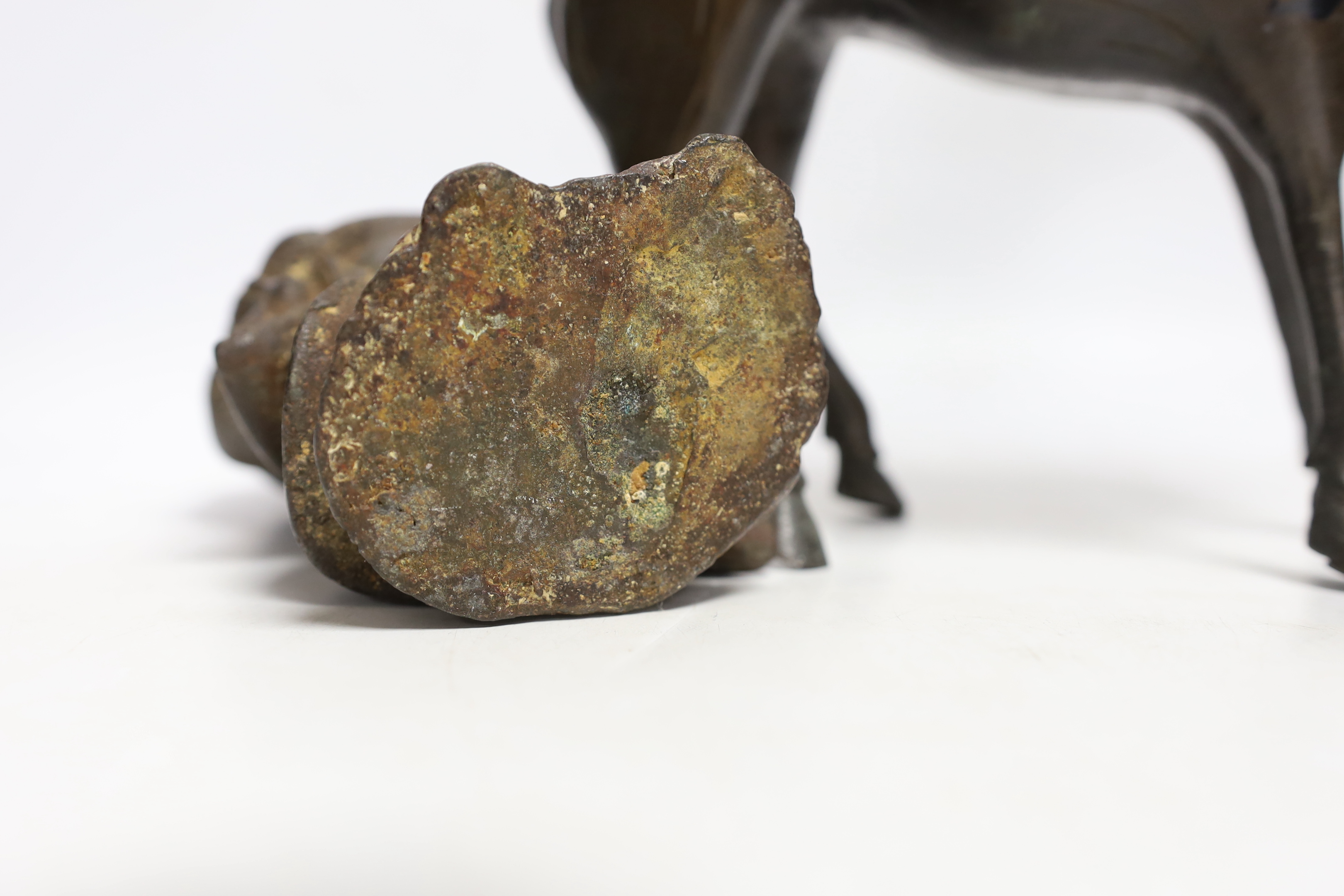 Two Chinese bronze figures; a luohan on his mule and a figure of a wise man, tallest 30cm